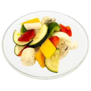 Das Bild zeigt den Gemüsemix Gemüse Pfanne auf einem flachen Glasteller